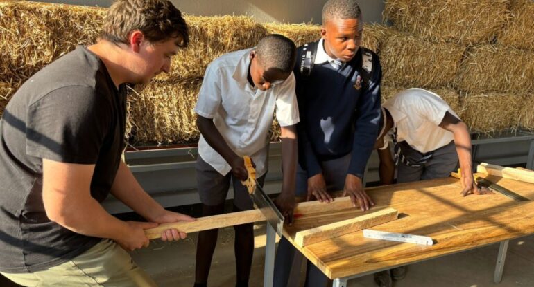 Learners go through some joinery lessons assisted by one expatriate teacher.