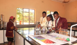 Some students at Marymount High School conducting experiments in the science lab